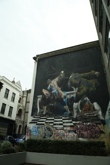The duel of Bristol by Irish artist Connor Harrington. The painting depicts an Irish flag between the legs of the fencer on the right and red-blue-white clothing on the fencer on the left. Possibly an allusion to the conflict between Ireland and the UK.