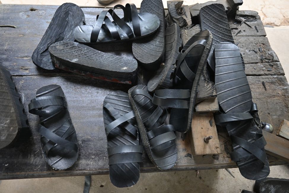 Shoes made from old tires, with imprints pointing in the opposite direction