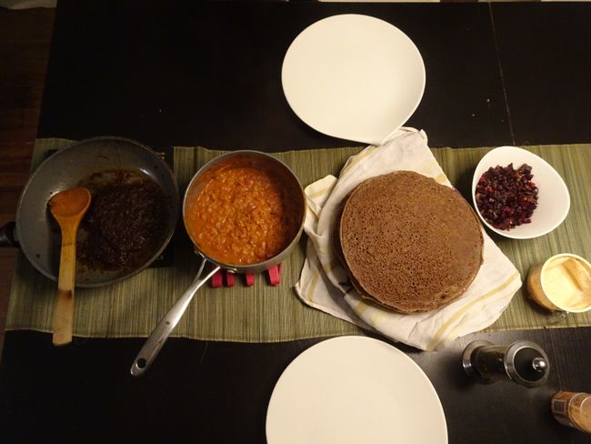 Homemade injera with wots