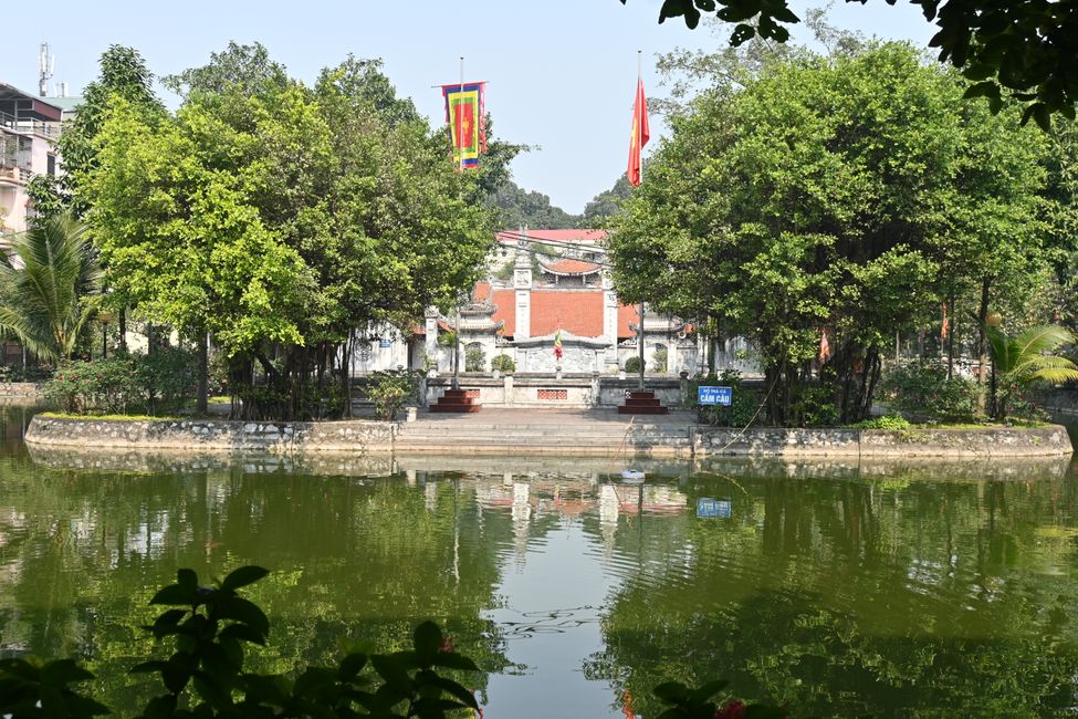 Hidden lake with temple complex between residential buildings