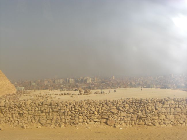 There is a smoky cloud of exhaust fumes and sand hanging over Cairo, the sight was shocking.