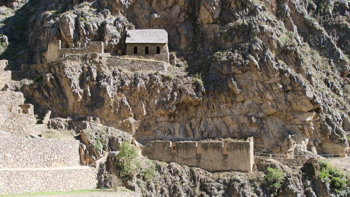 the town of Ollantaytambo and corn storage rooms in the background