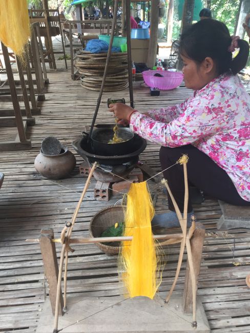Boiling the cocoons to remove the silk threads