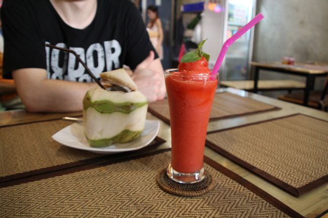 Strawberry smoothie and fresh coconut