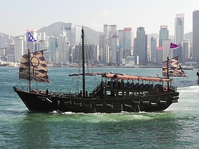 Traditional boat in front of Hong Kong Island