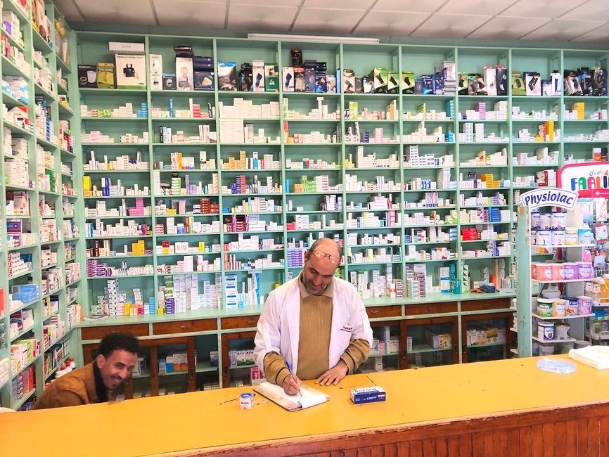 The owner of this pharmacy came out of his office just to be in the photo.