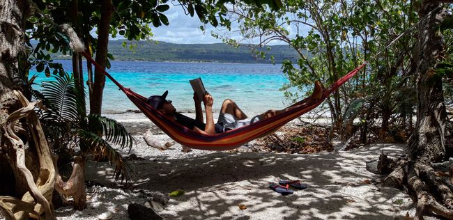 Reading in the hammock on the small private beach