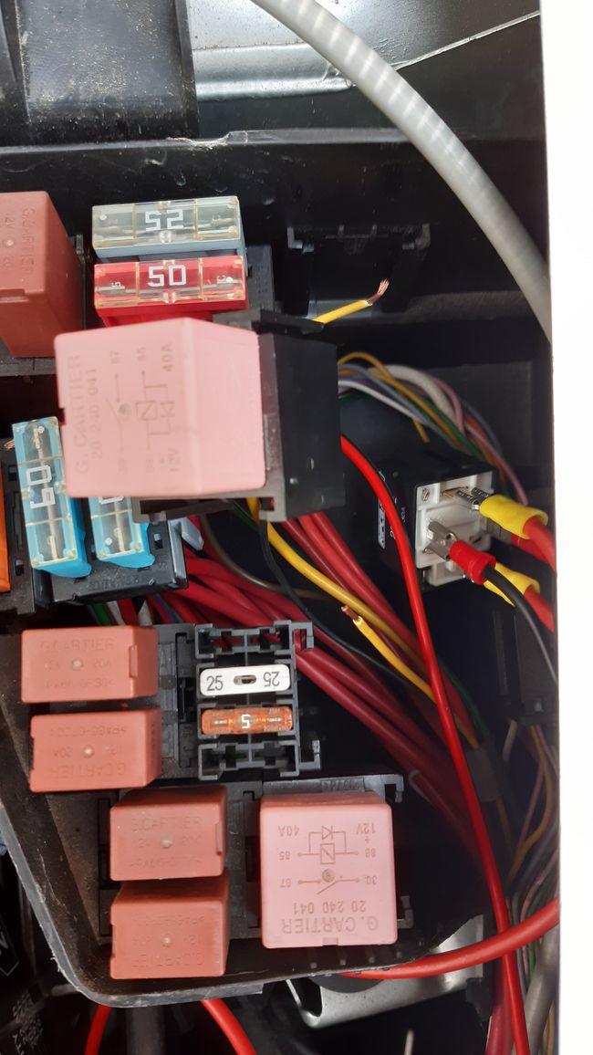 The relay fits in the fuse box