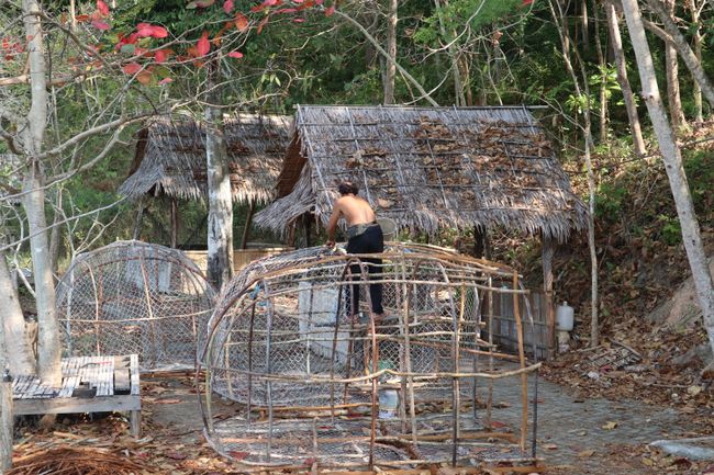 A man building a fishing net.