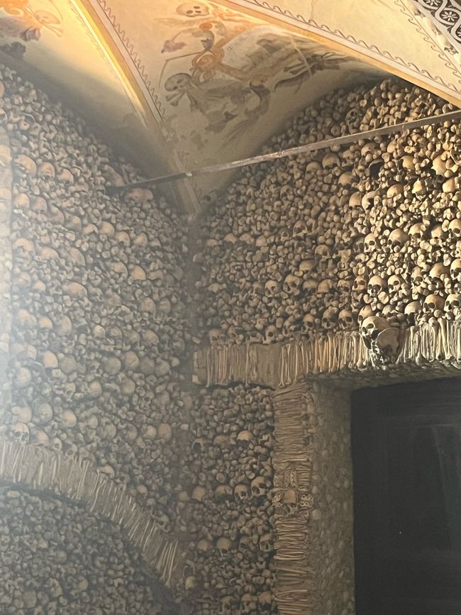 Two cultural extremes in one day: a bone chapel and the last bratwurst before America