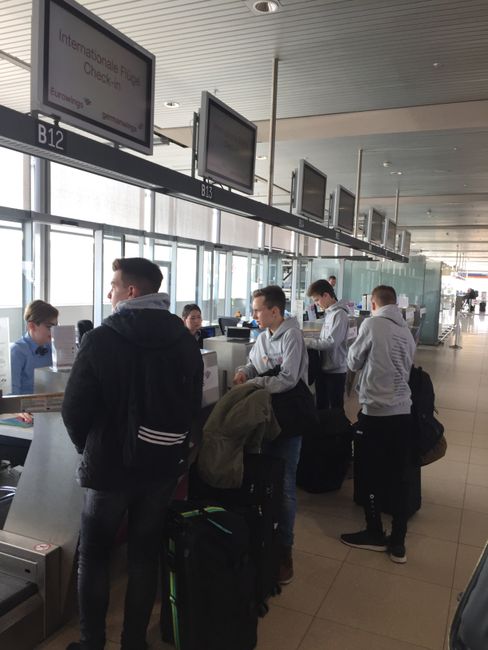 ...19 students occupy four check-in counters