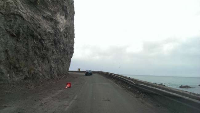 Damaged road right along the coast