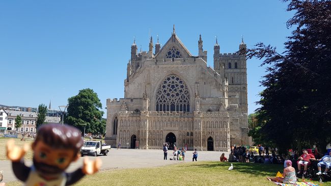 The Exeter Cathedral, with a cozy park in front of it where quite a few people gather around lunchtime