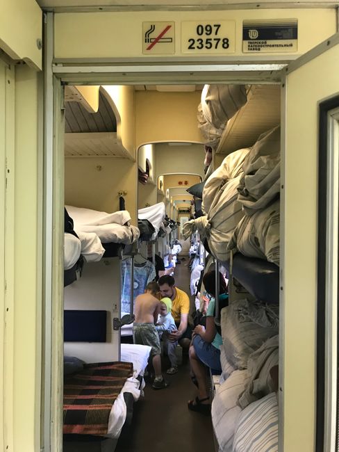3303 km, 50 hours, 1 compartment, 1 toilet, 54 people, 27 degrees