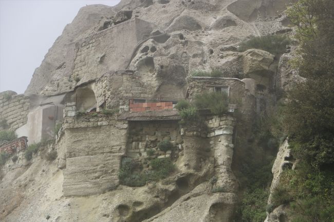 Houses and caves in the rock face