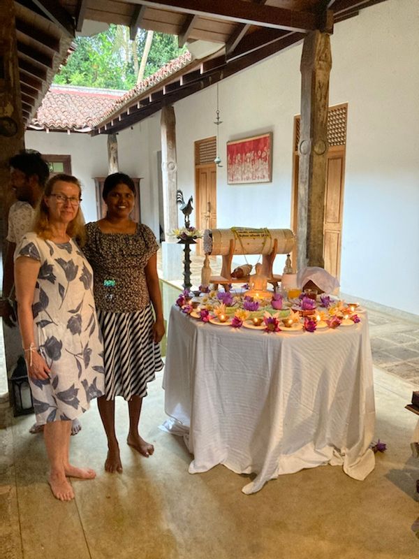 Claudia with Ashanti next to the altar