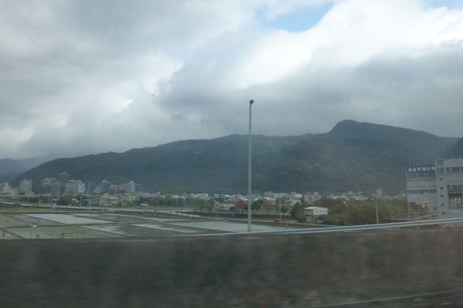 Taiwan looks like this over long distances. Mountains, many houses, and rice fields in between.