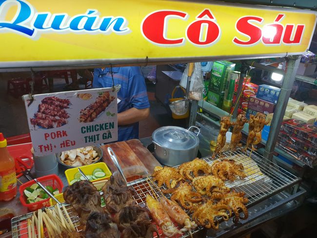 Street food stands with frogs and octopuses