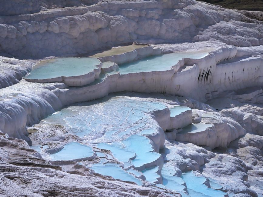 The travertine terraces of Pamukkale with their warm, turquoise water.
