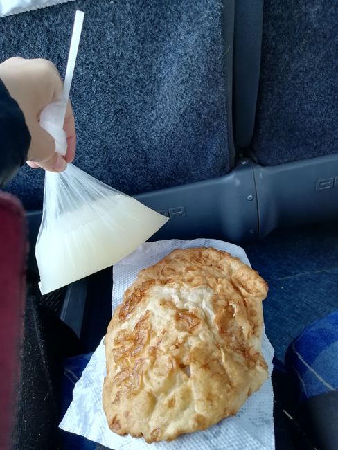 Tea in a plastic bag with bread for breakfast on the bus