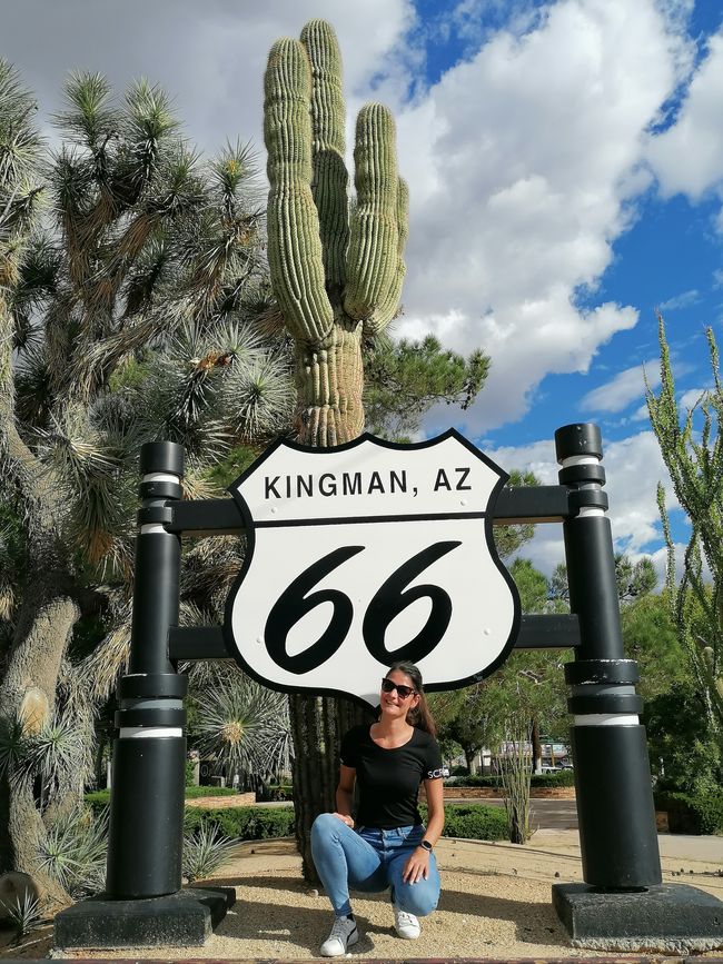 Posing in front of the giant cactus (and another Route 66 sign)