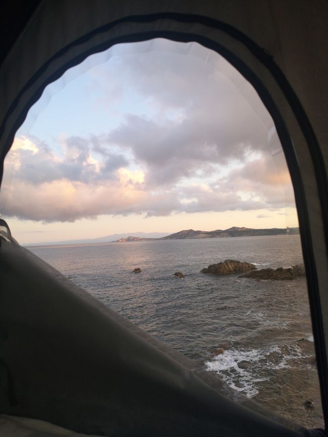 The view from the rooftop tent in the morning, listening to the sound of waves.