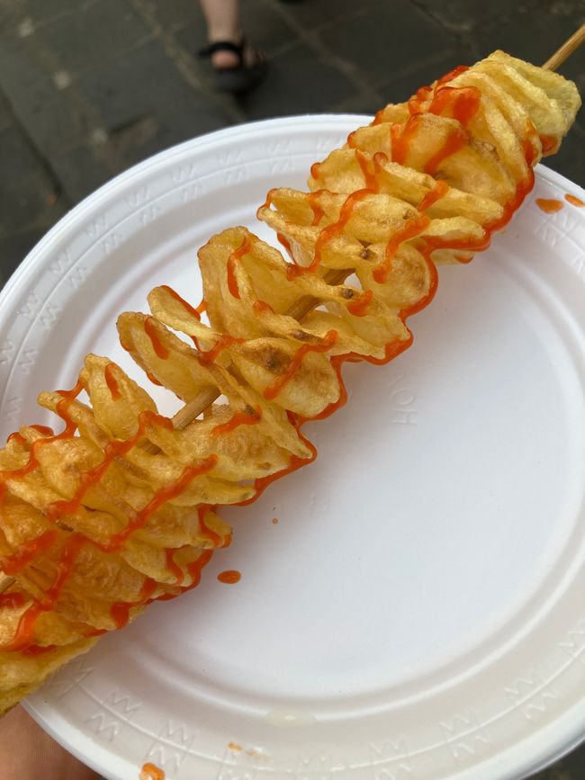 Spiral potato with chili sauce from street vendor