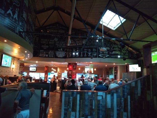 Crowded bar with 17 tvs