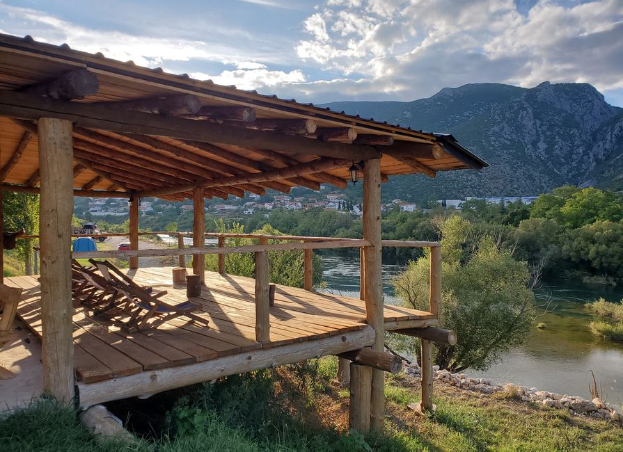Terrace of the campsite in Mostar, with the Neretva river in the background