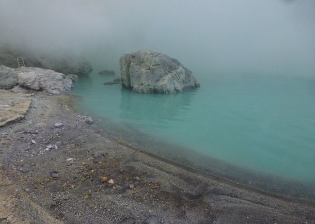 Kawah Ijen crater lake with its blue-green water
