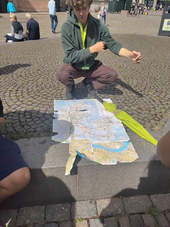 Our tour guide with a half-torn map of Denmark