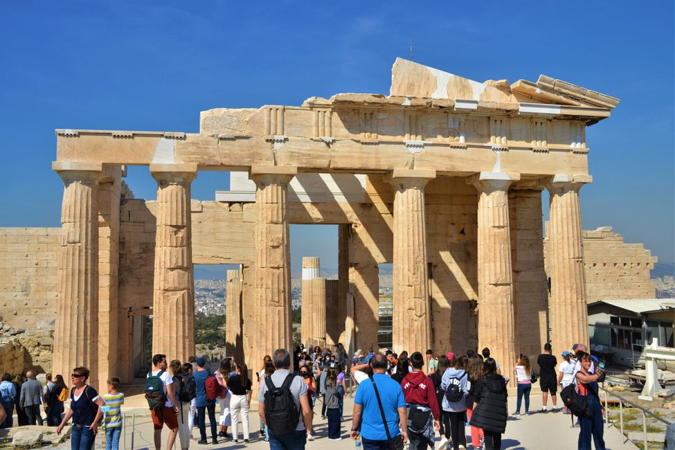 The Parthenon is still under reconstruction, with craftsmen sitting on top. 