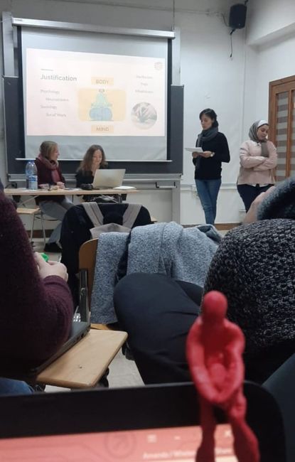 The final presentation of my favorite group with Sophia, Clara, and Rudaina, where we presented our sound project at Tarabot. The red figure in the foreground was created during the interactive introduction of our presentation, in which everyone was supposed to blindfoldedly knead their body.