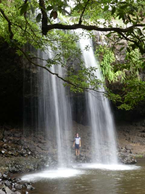 Andi behind the waterfall
