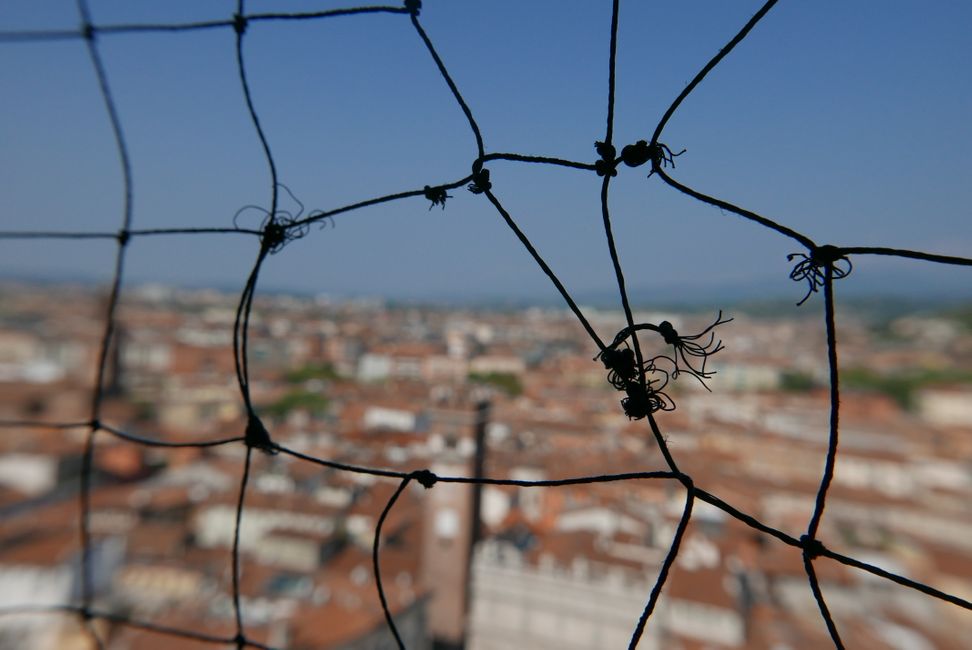 Nets with photo holes on top of Torre dei Lamberti
