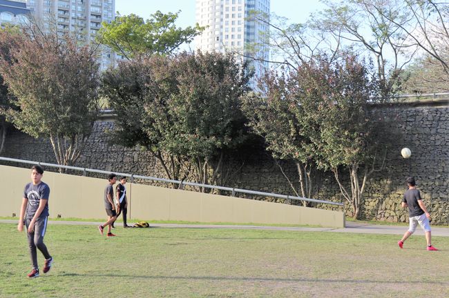 Boys playing soccer in the park