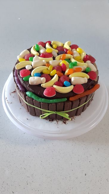 Sponge cake with chocolate filling, gluten-free cookies, and gluten-free lollies