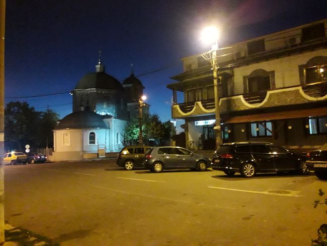 Guesthouse and church at the Tulcea sign