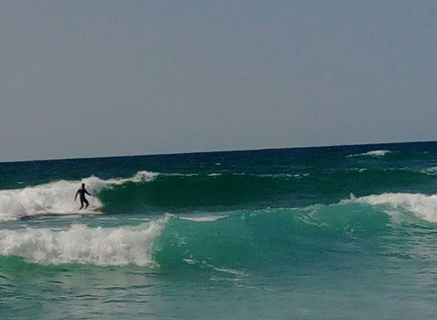 Surfing on the Atlantic. It's a great feeling of happiness to ride the waves on the board. highly recommended