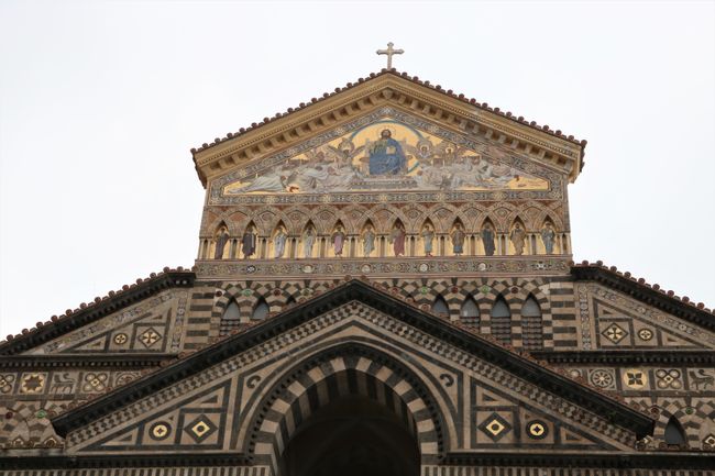The facade is decorated with gold mosaics