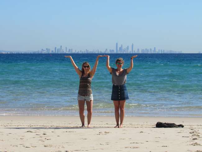 Milli and Lisa carrying Surfers Paradise on their hands 