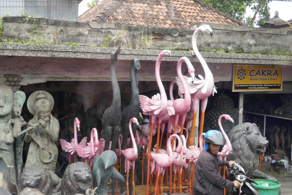Temple figures are offered along the road