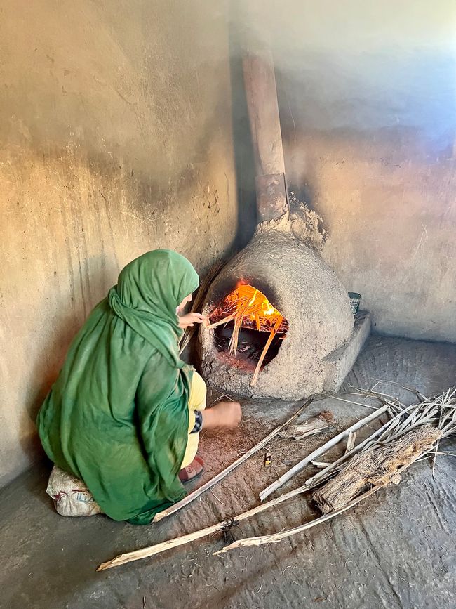 A Moroccan woman baking bread.