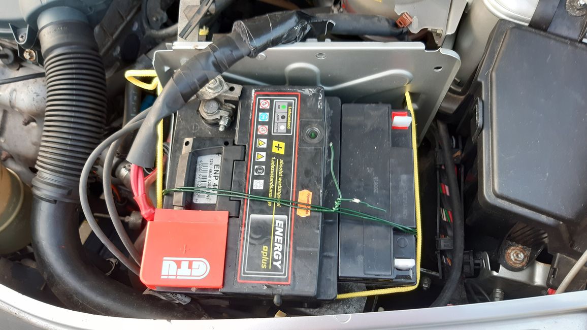 The second battery fits next to the 90-degree turned starter battery