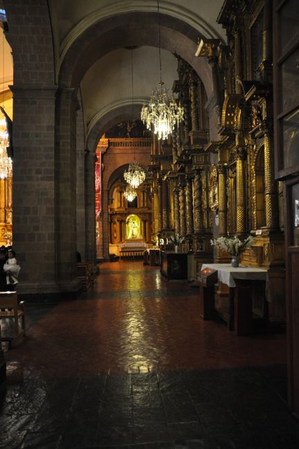 Side aisle of the church La Mercéd with many altars
