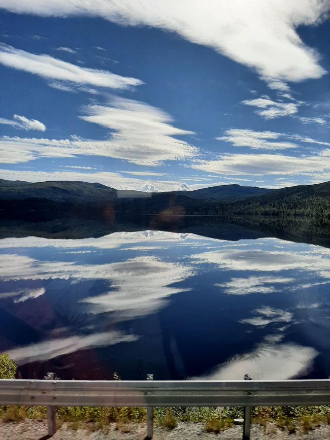 Sky reflects in calm lake