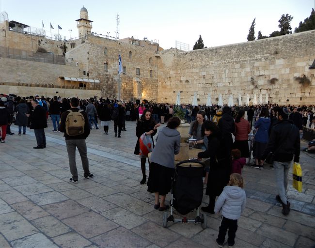 Afterwards, Hanukkah celebration at the Western Wall. Hanni washes her hands first...
