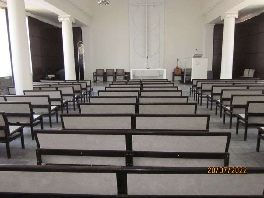 Priest next to the altar