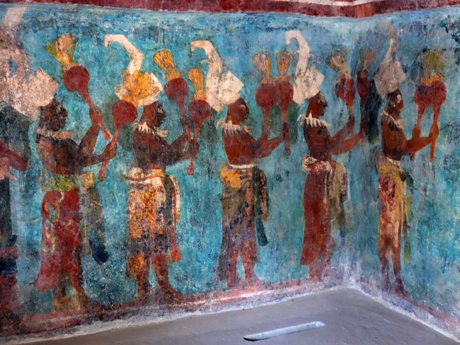 A procession of Maya musicians in Bonampak. They celebrate the victory in a battle with rattles made from pumpkin shells.