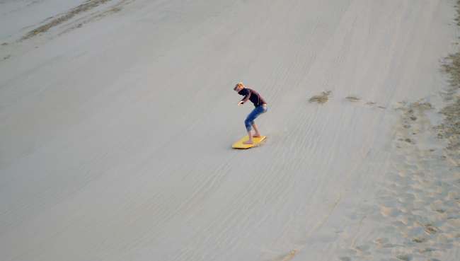Surfing on sand dunes